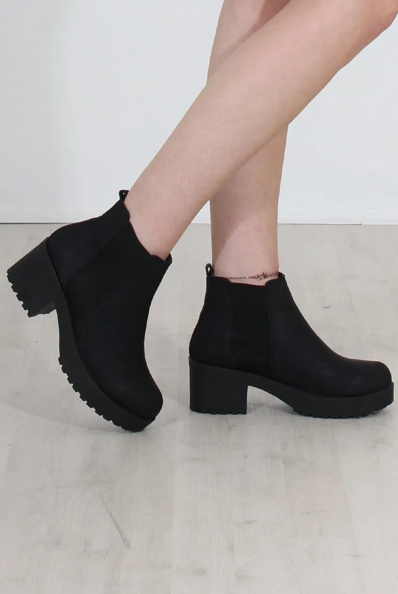 Black Faux Leather Ankle Boots by Zohey